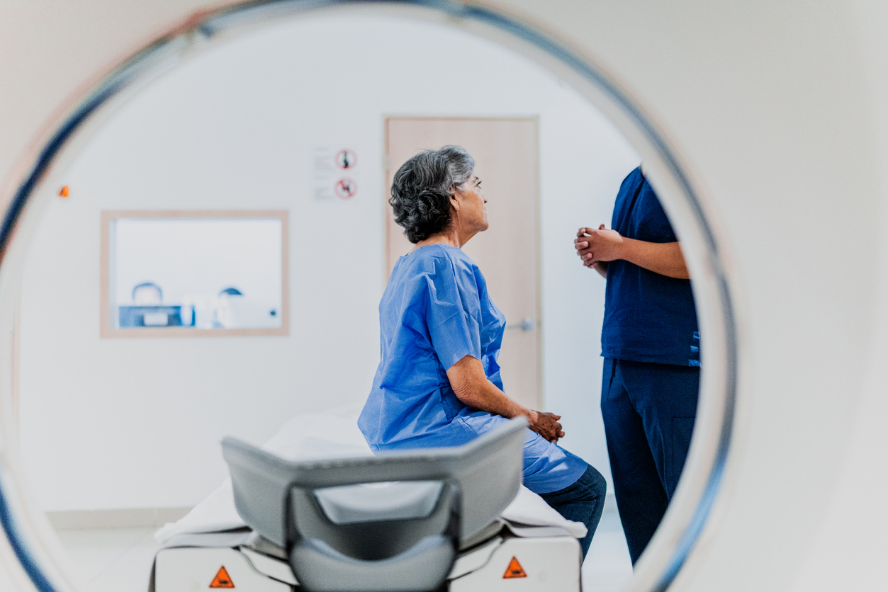 Senior woman talking to a nurse on a MRI tomography at hospital CT, MRI, Mammography, NM, Ultrasound & PACS, Radiology Leadership